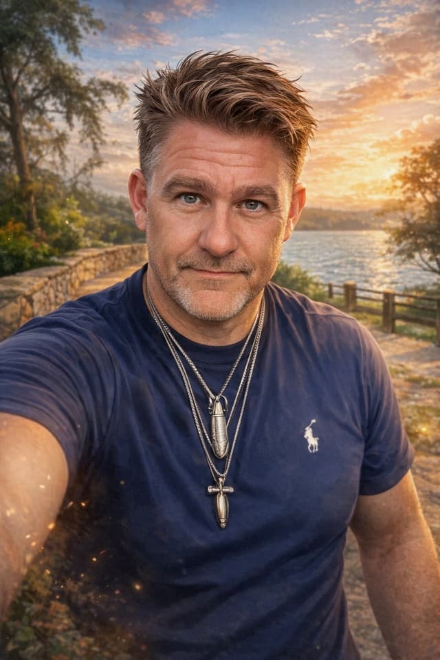 JC Grigg professional portrait at lakeside during golden hour
