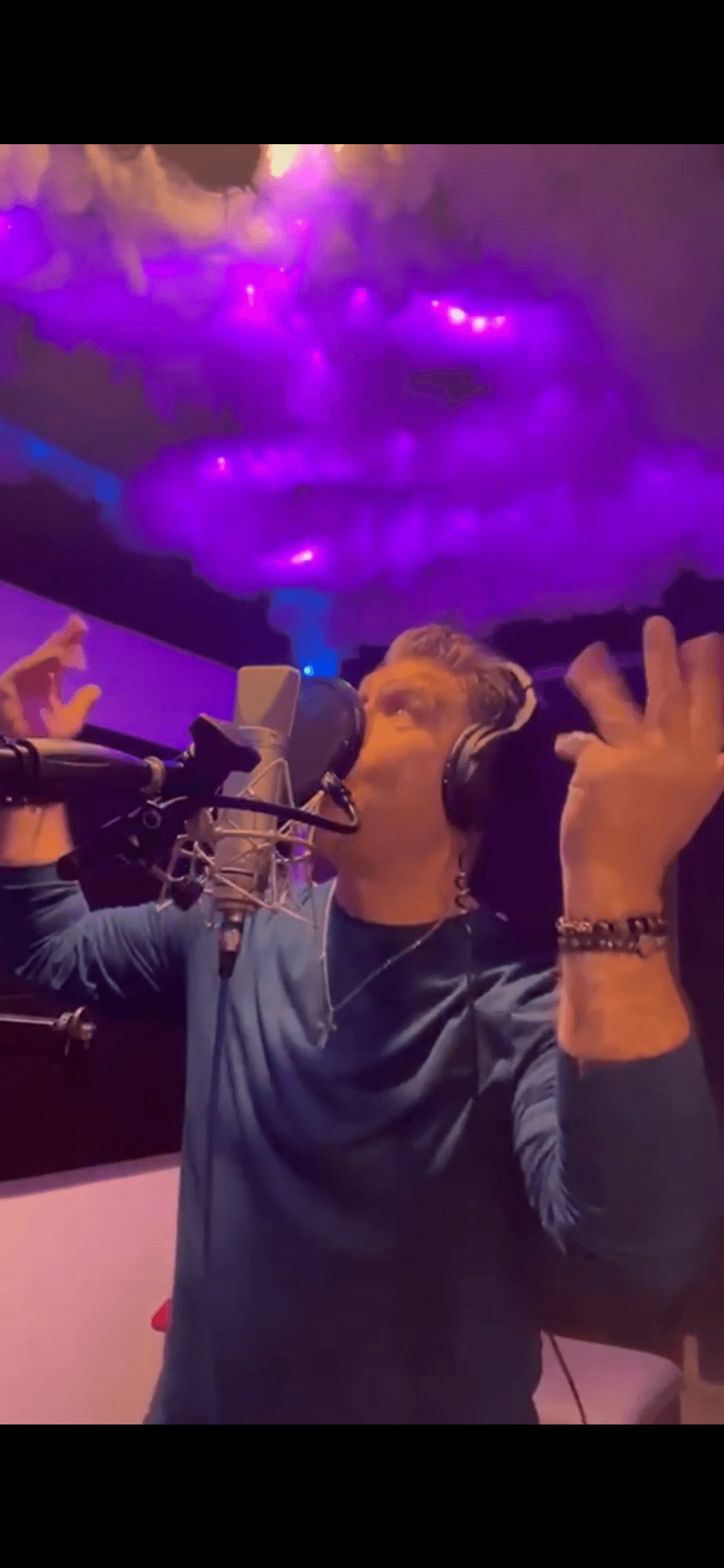 JC Grigg recording in professional studio with LED lighting