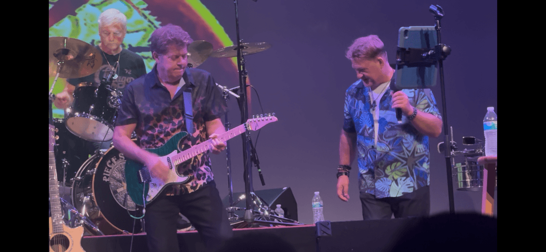 Wide stage view of JC Grigg and Keith Howland with the full Pieces of Eight band