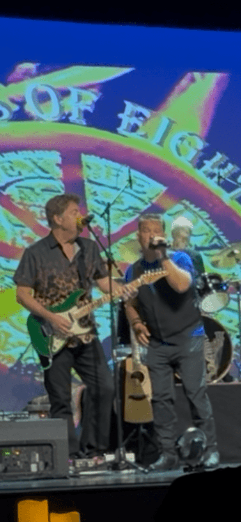 JC Grigg and Keith Howland singing together on stage