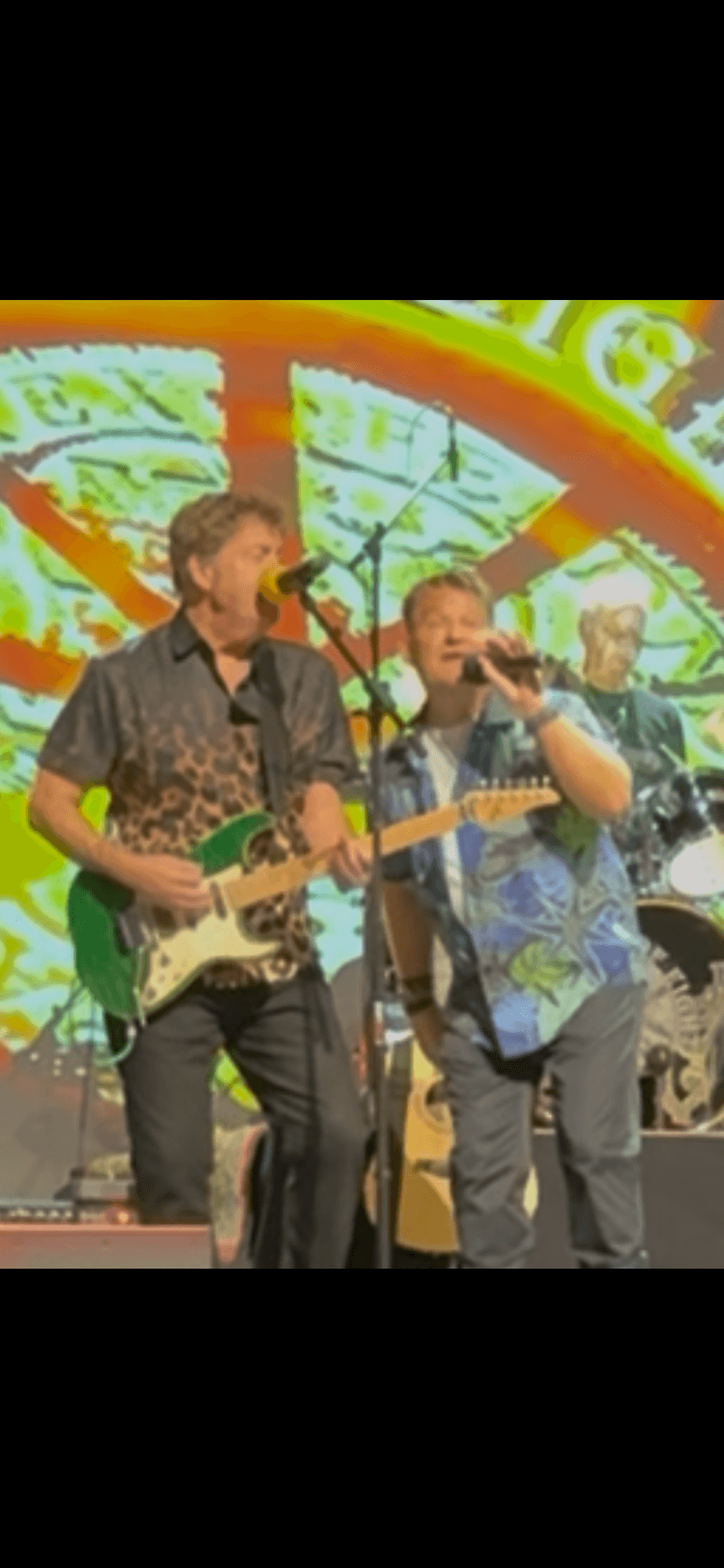JC Grigg, Keith Howland, and bandmate performing vocals together