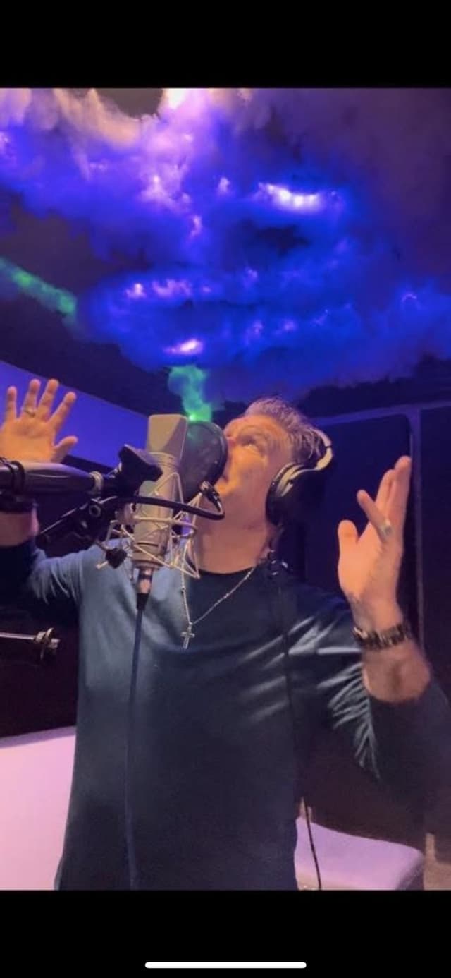 JC Grigg vocal recording session in studio with blue and purple lighting