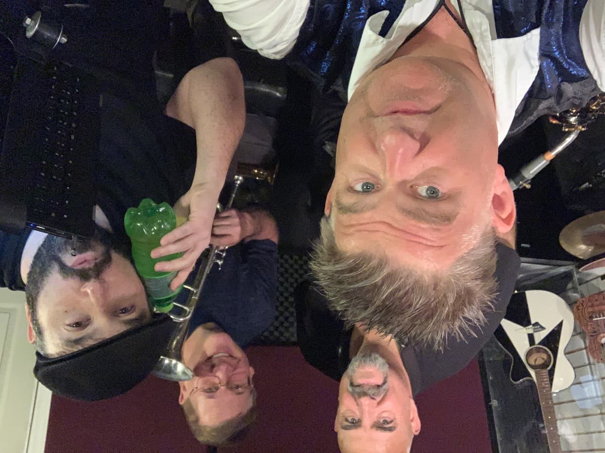 Pieces of Eight Chicago tribute band from Tampa - group selfie of band members with instruments