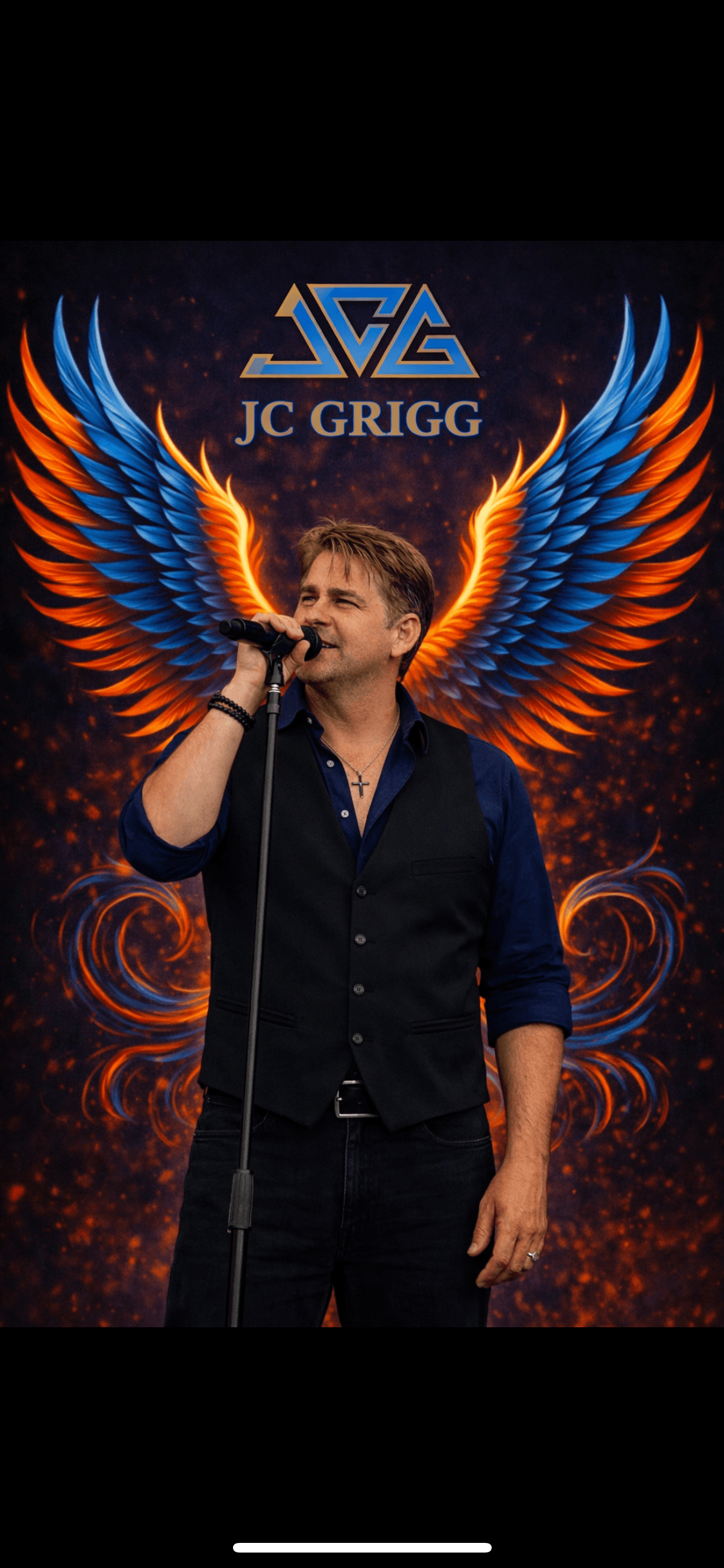JC Grigg performing with phoenix wings and JCG logo