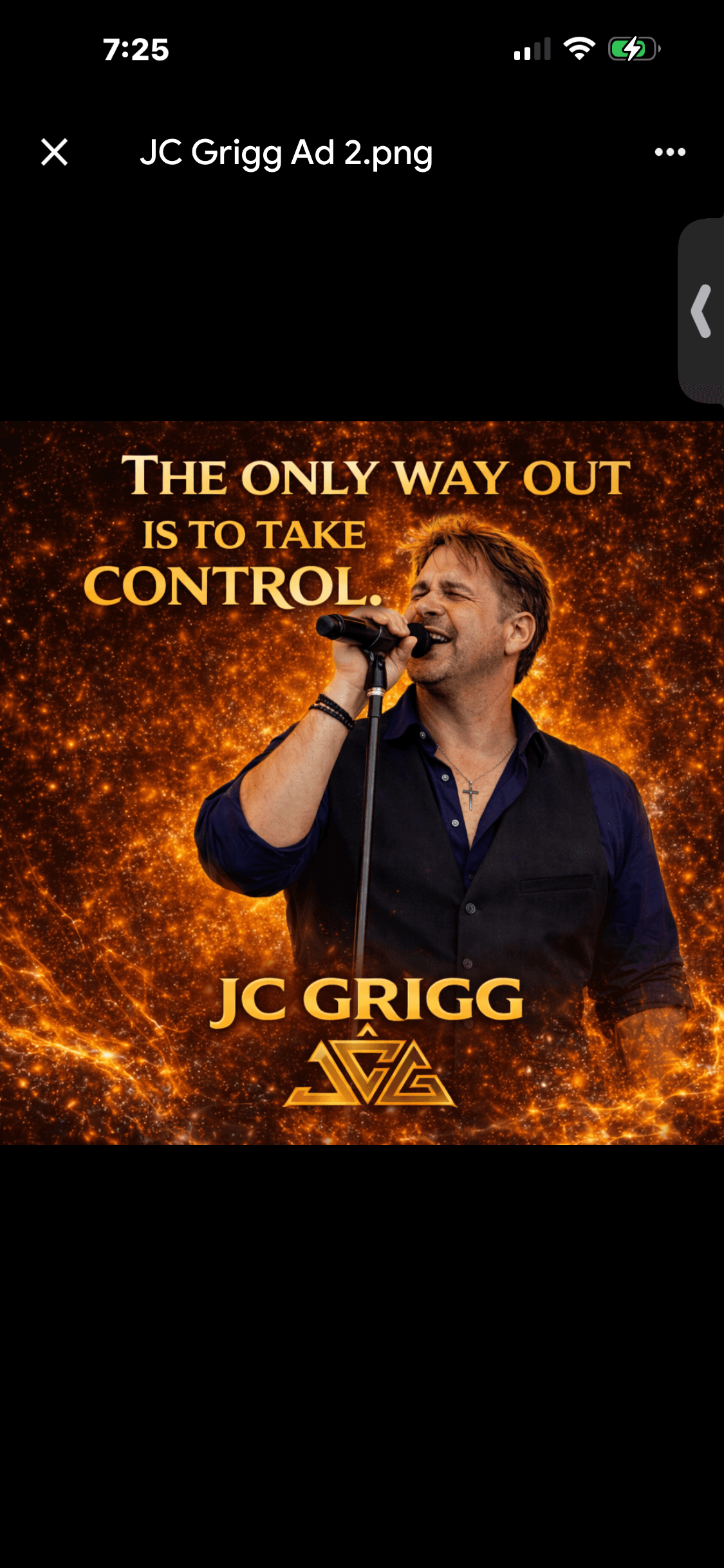 JC Grigg performing against orange fire backdrop — The only way out is to take control.